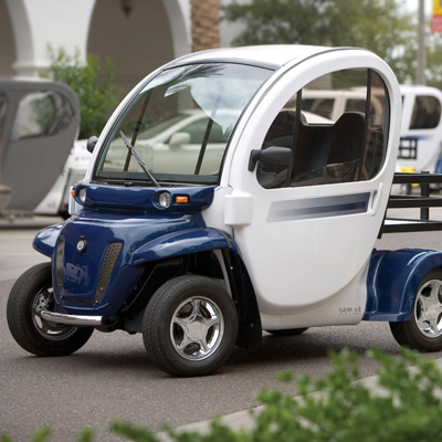 GEM® e2 Electric Car - Economic and environmentally friendly, this two-passenger vehicle is ideal for the short trips you make every day. Six 12-volt flooded electrolyte batteries provide a range of up to 35 miles on a charge.
